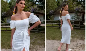 Kobieta w białej, ażurowej sukience z odkrytymi ramionami, w stylu, który przypomina, jak wyglądają hiszpanki.