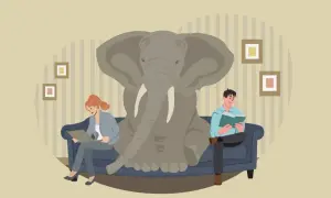 Un elefante en la habitación, un ejemplo de **idioms with animals**. Dos personas leen en un sofá, ignorando al paquidermo.
