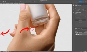 Pokazano, jak wymazać tło ze zdjęcia w Photoshopie. Dłoń trzymająca buteleczkę z kosmetykiem na przezroczystym tle.