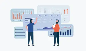 Due persone analizzano grafici e dati, un esempio di hr analytics per prendere decisioni strategiche.