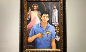 Obraz przedstawia błogosławionego Carlo Acutisa z monstrancją, w tle Jezus Miłosierny i Matka Boża.