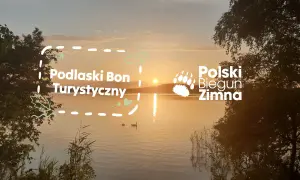 Zachód słońca nad jeziorem, z napisem "Podlaski Bon Turystyczny 2026" i "Polski Biegun Zimna".