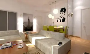 Un moderno soggiorno con un divano davanti alla porta finestra, un quadro di Audrey Hepburn e una vista di New York.