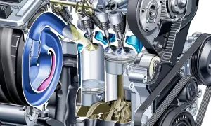 Przekrój silnika z widocznymi tłokami, zaworami i paskiem rozrządu. Ilustracja pokazuje mechanizm, który może prowadzić do spalania stukowego.