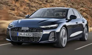 Eleganckie Audi A6 w ciemnym kolorze, jadące po drodze. Sprawdź atrakcyjną audi a6 cena i wybierz swój wymarzony model.