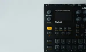 Black Digitakt drum machine with buttons and knobs. This powerful free drum machine is ready to create beats.