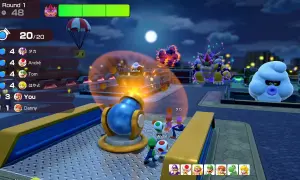 Postacie z Mario Party Jamboree w nocy, Bowser i Boo patrzą na armatę.