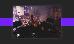 DJ playing to a cheering crowd, a scene that inspires anyone wondering how to get DJ gigs.