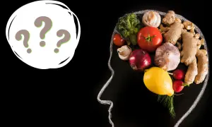 Psychodietetyk czym się zajmuje? Zdrowa dieta wpływa na mózg, co pokazuje kompozycja warzyw i owoców w zarysie głowy.