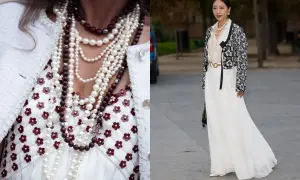 Elegancka kobieta w styl retro ubrania, z wieloma naszyjnikami z pereł i kamieni, w białej sukni i ozdobnej marynarce.