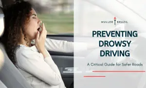 Preventing drowsy driving is crucial, especially for those with conditions like narcolepsy. This image shows a woman yawning while driving, highlighting the dangers.