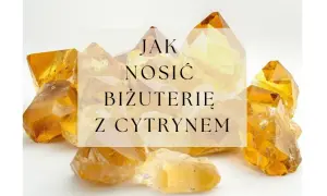 Kryształy cytrynu o żółto-pomarańczowym odcieniu na białym tle.