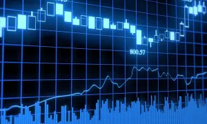 Wykresy finansowe pokazują zmienność rynkową, sugerując potencjalną fuzję banków i jej wpływ na kursy.