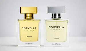 Dwie butelki perfum Sorvella Premium, jedna ze złotą, druga ze srebrną nakrętką. Wyglądają jak oryginalne.