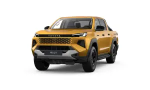 Złoty Toyota Hilux z czarnymi dodatkami i nowoczesnym grillem, gotowy na każdą przygodę.