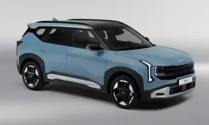 Niebieski Kia Seltos z czarnym dachem i srebrnymi akcentami, prezentujący nowoczesny design.