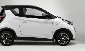 Auto elettrica bianca e nera, modello DR 1.0, vista di lato. Design moderno e compatto.