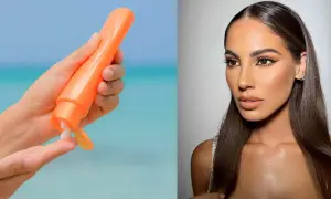 Mano con crema solare arancione, per godersi il sole in sicurezza. Si abbronza con la protezione 50, per una pelle protetta e luminosa.
