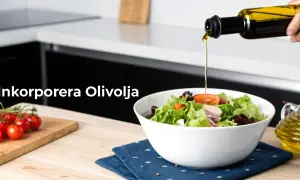En hand häller olivolja över en fräsch sallad. Tänk på olivolja kalorier för en balanserad kost.