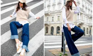 Stylowa kobieta pokazuje, jak nosić kamizelkę damską: luźne jeansy, biała koszula i beżowa kamizelka tworzą modny zestaw.