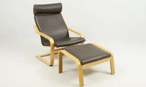 Brown leather armchair with a matching ottoman, featuring bentwood frames.