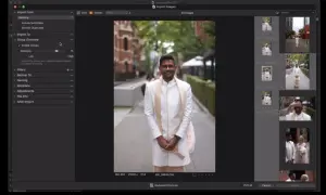 Mężczyzna w białej kurtce i szalu pozuje do zdjęcia. Capture One 23 grupuje obrazy ślubne.