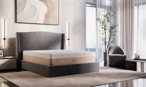 A Saatva memory foam mattress on a bed, showcasing its durability and comfort in a modern bedroom setting.