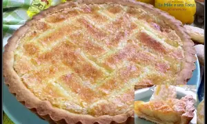 Deliziosa crostata beneventana con un ripieno dorato e una griglia di pasta frolla. Accanto, una fetta servita con panna montata.