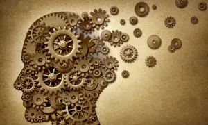 Profilo umano composto da ingranaggi, simbolo di un approccio breve strategico e del funzionamento della mente.