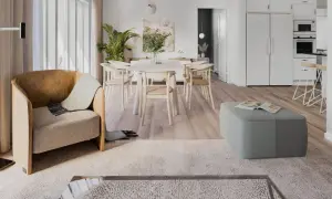 Ett ljust och luftigt vardagsrum med matplats i klassisk nordisk design. En bekväm fåtölj och en grön pall skapar en inbjudande atmosfär.