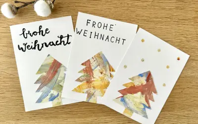 Drei selbstgebastelte Weihnachtskarten mit bunten Bäumen – tolle Ideen zum Weihnachtskarten basteln mit Kindern!