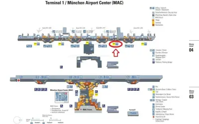 Plan lotniska w Monachium, Terminal 1. Widoczny jest obszar MAC z zaznaczonym przystankiem TAXI BUS.