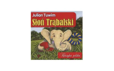 Słoń Trąbalski, bohater wiersza Tuwima, siedzi w trawie z czerwonym kapeluszem i kółkiem ratunkowym.