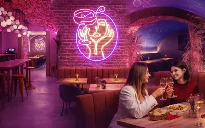 Dwie kobiety wznoszą toast w klimatycznym wnętrzu, gdzie neonowy portret i ceglane ściany tworzą atmosferę nietypowych restauracji w Warszawie.