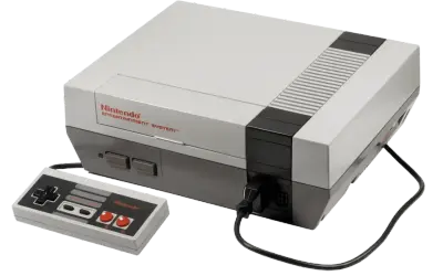 Konsola Nintendo Entertainment System z padem, klasyka **gier z dzieciństwa na komputer**.