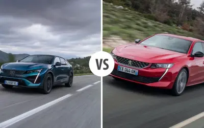 Dwa modele Peugeot sedan: jeden niebieski, drugi czerwony, jadące po drodze.