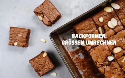 Saftige amerikanische Masse Brownies, frisch aus der Form geschnitten, mit Mandelsplittern verziert.