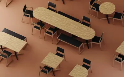 Ensemble de tables et chaises en bois clair et noir, parfait pour l'art de la table professionnel.