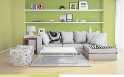 Nowoczesny salon z kanapą, stolikiem i pufami. Ściany w odcieniu oliwkowym tworzą przytulną atmosferę.