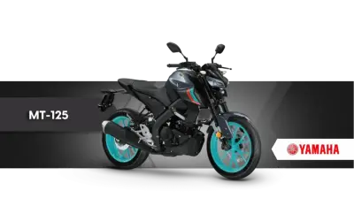 Szary motocykl Yamaha MT-125 z turkusowymi felgami, idealny na pierwsze **a1 prawo jazdy**.