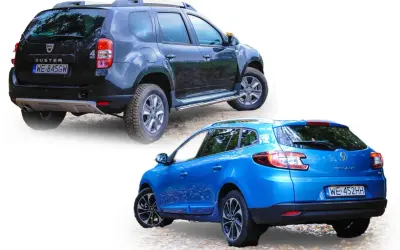 Niebieski Renault Megane Grandtour i czarny Dacia Duster stoją obok siebie na żwirowej drodze.