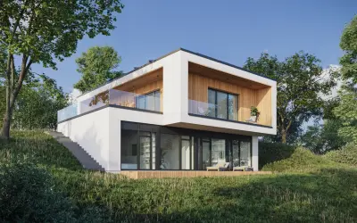 Nowoczesne domki na skarpie z przeszklonymi balkonami i tarasem, otoczone zielenią.