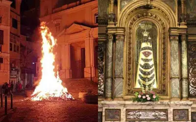 Fuoco acceso e statua della Madonna di Loreto in chiesa: immagini che evocano la devozione e le celebrazioni quando si festeggia la Madonna di Loreto.