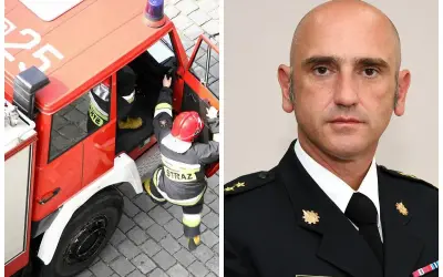 Brygadier K. Gielsa w mundurze, obok niego strażak wsiada do wozu strażackiego.