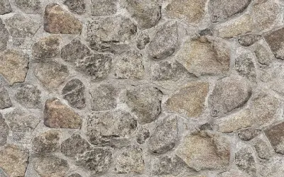 Kamień naturalny w murze, szary i brązowy. Czym czyścić kamień naturalny? Delikatnie, by nie uszkodzić jego piękna.