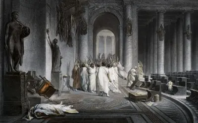 Die Ermordung Caesars: Senatoren mit erhobenen Dolchen umringen den gefallenen Diktator. Ein umgestürzter Stuhl und eine Leiche auf dem Boden zeugen vom brutalen Ende.