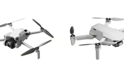 Dwa białe drony, jeden z przodu z kamerą, drugi z boku. Dron zasięg 10km, idealny do podniebnych podróży.