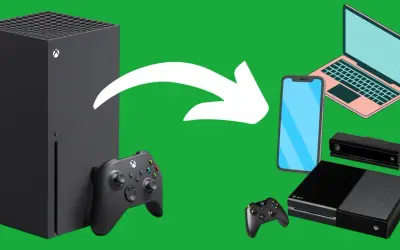 Xbox Series X obok Xbox One, kontrolerów, telefonu i laptopa. Czy gry z Xbox One działają na Xbox Series X?
