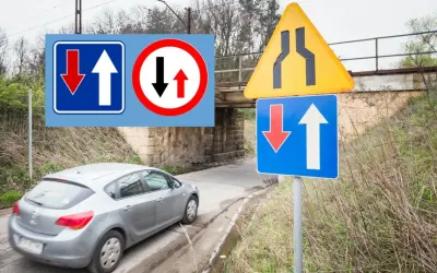 Znaki drogowe informują o pierwszeństwie przejazdu i zwężeniu drogi. Kierowca musi wykonać manewr wymijania.