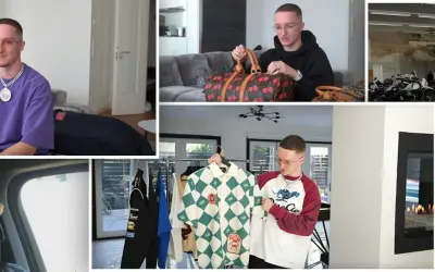 Mann mit Brille präsentiert seine Justin Modemarke Kollektion, darunter Hoodies, Hemden und eine Tasche mit Kirschen.